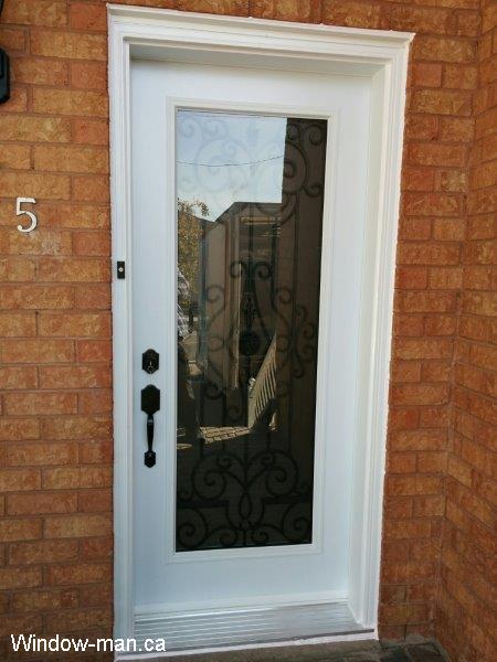 Single steel insulated front exterior door. White color. Oldcastle wrought iron glass insert